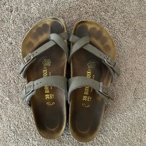 Brown, thin-strapped Birkenstocks